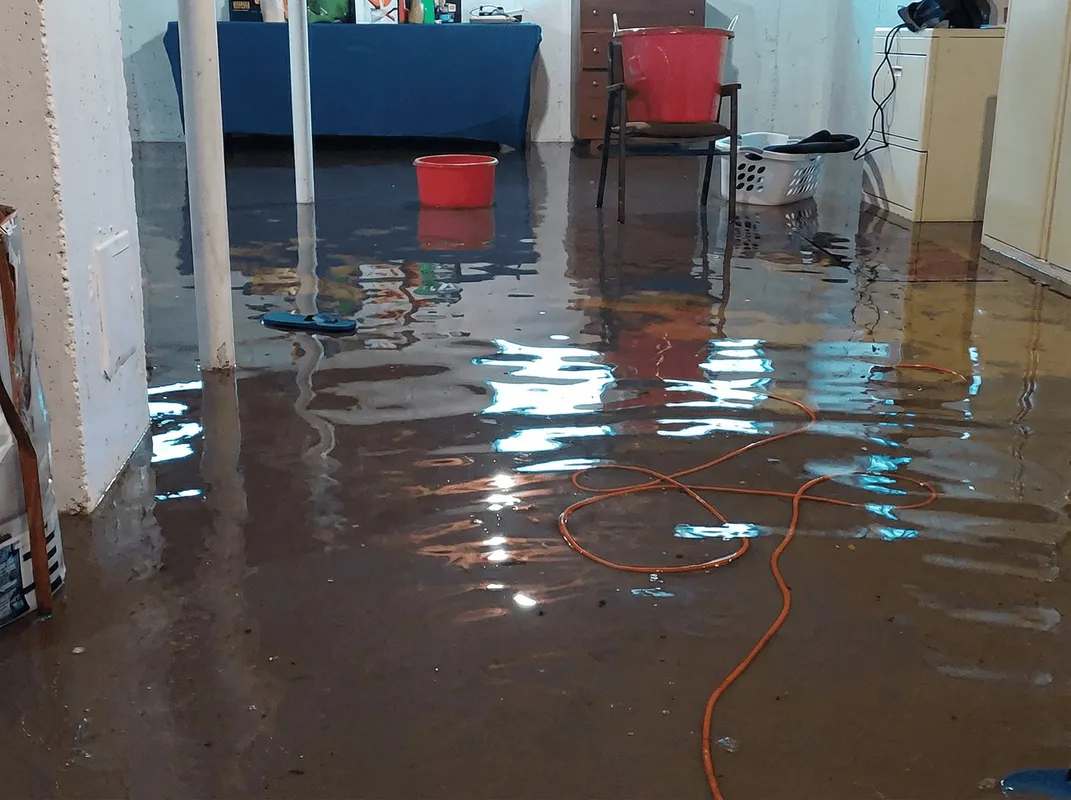 Basement with boiler, cabinets and washing machine completely flooded in Manchester, NH